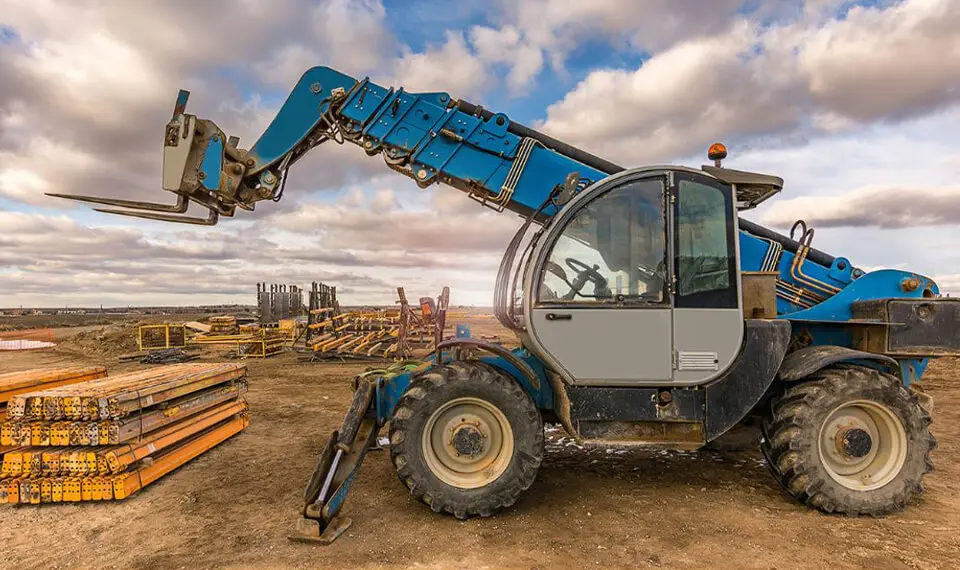 A photo of a telehandler parked at a job site.